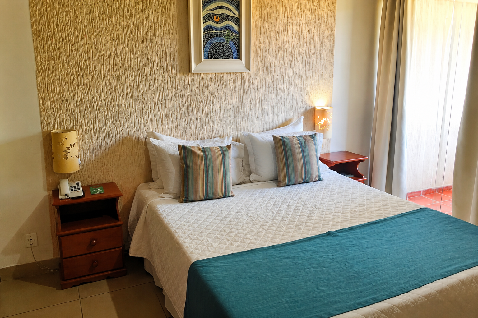 Apartamento Standard com cama de casal e parede texturizada